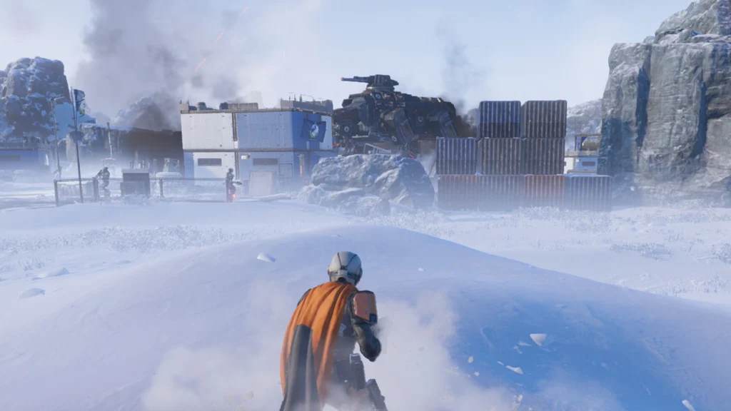A lone Helldiver cressing a hill to find a Factory Strider among human buildings