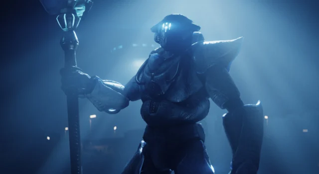 A Helldivers 2 Illuminate Overseer standing in the light of a warship while other warpships are in the background