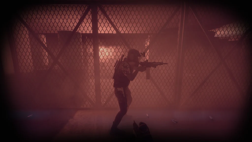 A SWAT officer walking through gas with a pepperball gun