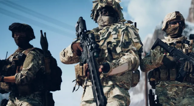A low angle camera angle of three soldiers with the Battlefield 6 Training Paths equipped
