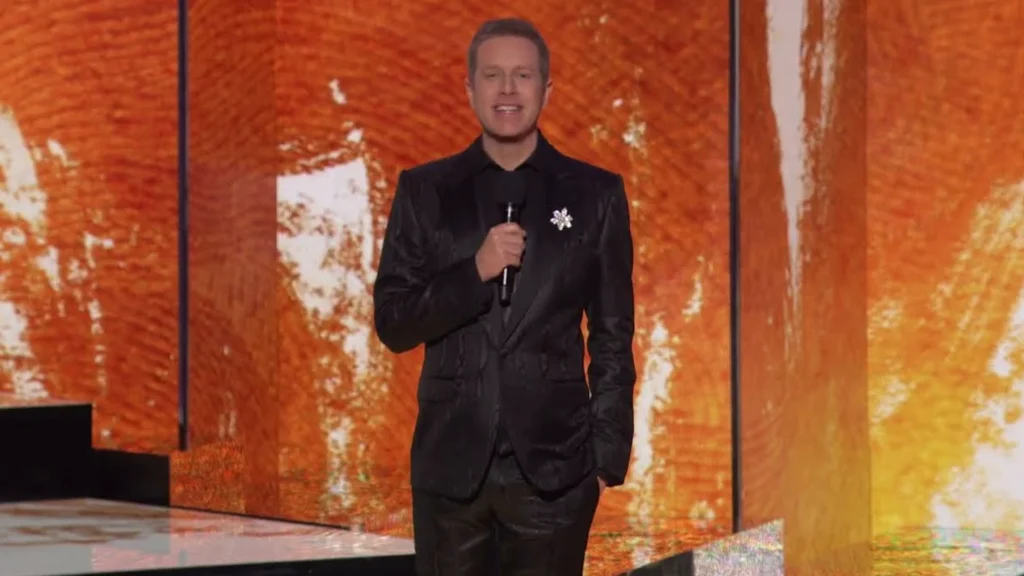 The host of the Game Awards standing on stage with a microphone