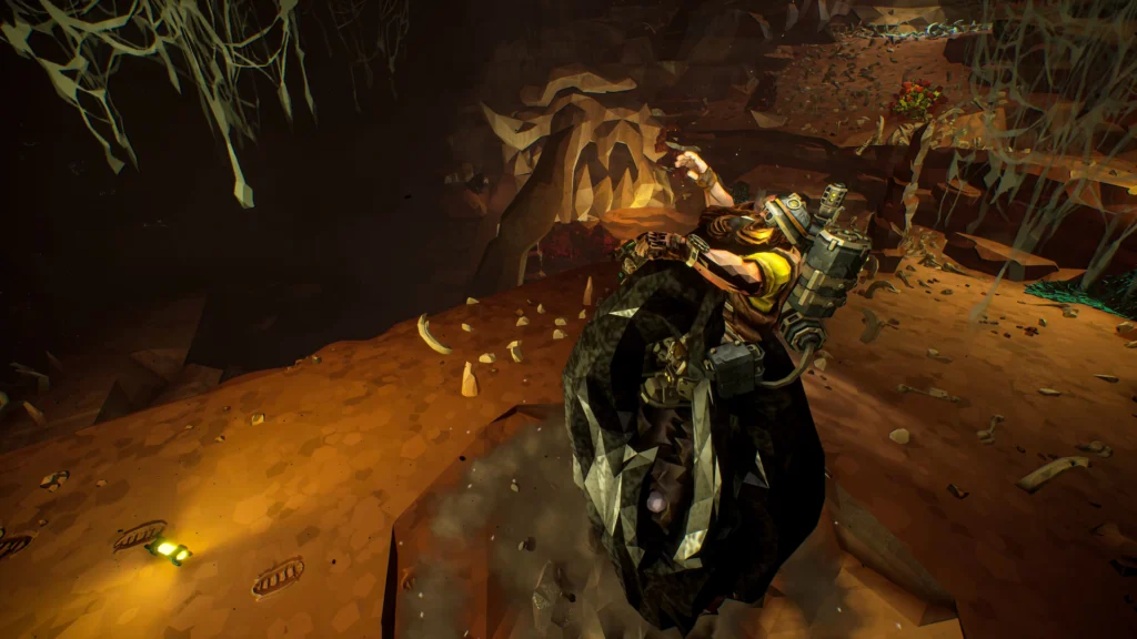 One of the Deep Rock Galactic Ossiran enemies, the Pit Jaw, grabbing onto a dwarf from under the ground