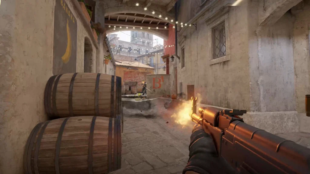 A player rushing B on the Inferno map in Counter-Strike 2 with an AK-47 that received changes in the Counter-Strike 2 magazine changes
