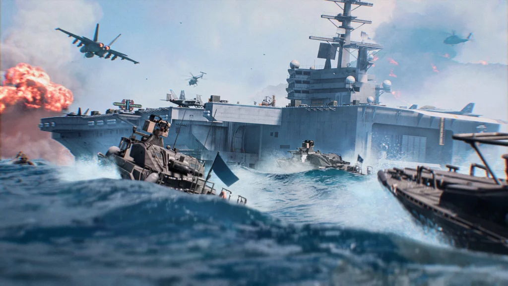 Several RCB-90 boats sailing next to a massive aircraft carrier while a jet flies above them
